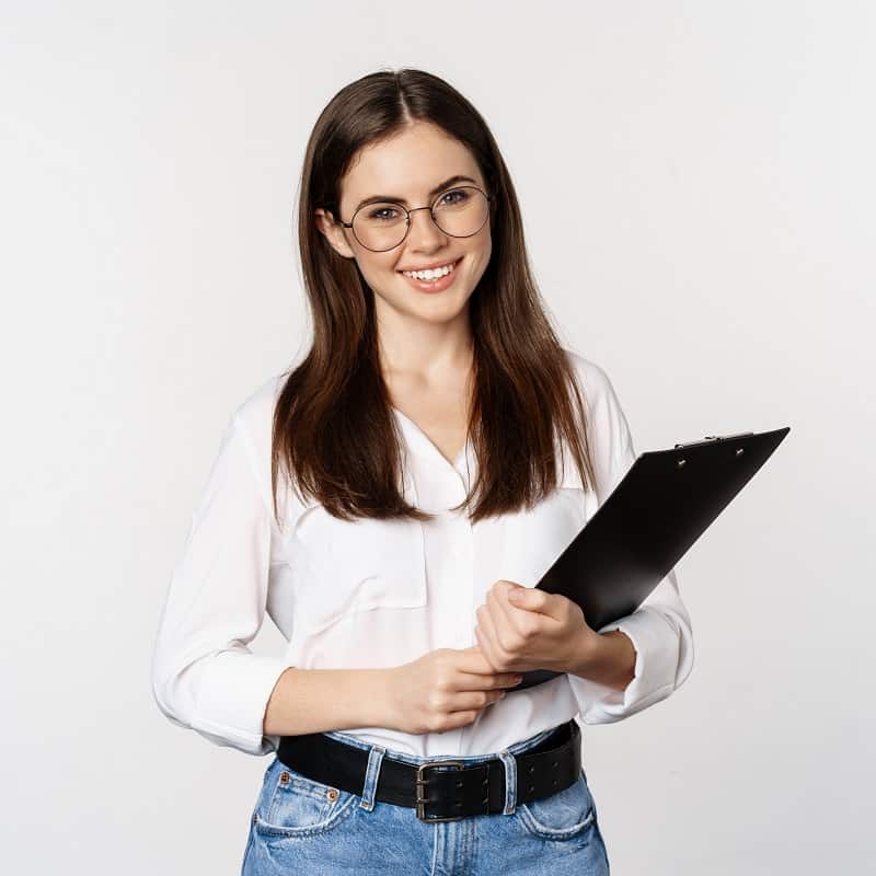 Portrait of corporate woman holding clipboard at work, standing in formal outfit over white background