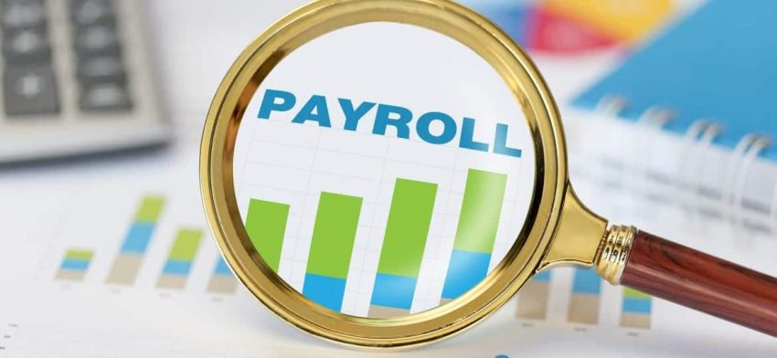 payroll being viewed in magnifying glass payroll being viewed in magnifying glass